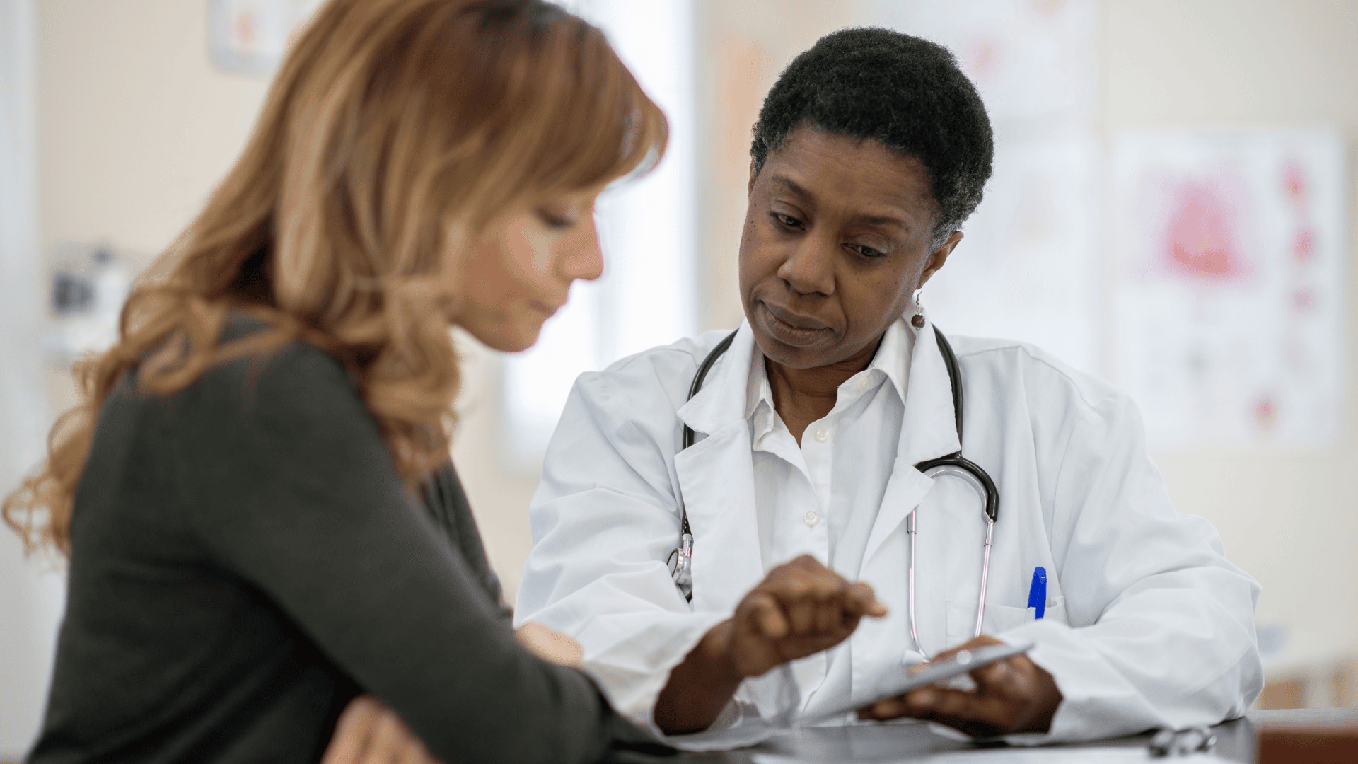 Doctor reviewing health information with a patient